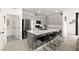 Modern kitchen with stainless steel appliances, a large island with seating, and sleek cabinets at 5530 Hill Spire St, Las Vegas, NV 89166