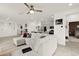Bright and open living area with a large sectional sofa and view to the kitchen at 5530 Hill Spire St, Las Vegas, NV 89166