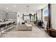 Open concept living area with natural light, featuring a comfortable sectional sofa and modern finishes at 5530 Hill Spire St, Las Vegas, NV 89166