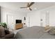 Bedroom features a ceiling fan, neutral décor, and ensuite bathroom access at 5530 Hill Spire St, Las Vegas, NV 89166