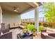 Inviting covered patio with comfortable seating, stylish decor, and pleasant outdoor view at 5530 Hill Spire St, Las Vegas, NV 89166