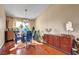Dining room with hardwood floors, modern lighting, and table with chairs at 5731 Fonchester Ct, Las Vegas, NV 89110