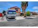 Two-story home with RV parked out front on driveway near palm trees at 5731 Fonchester Ct, Las Vegas, NV 89110