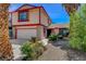 Two-story home with front yard landscaping and attached garage at 5731 Fonchester Ct, Las Vegas, NV 89110