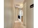Hallway with neutral paint, leading to various rooms, showing the home's layout at 5731 Fonchester Ct, Las Vegas, NV 89110