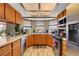 Bright kitchen with stainless steel appliances, and a window overlooking the backyard at 5731 Fonchester Ct, Las Vegas, NV 89110