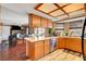 Open kitchen flows into living room; stainless appliances, wood cabinets, tile floors at 5731 Fonchester Ct, Las Vegas, NV 89110