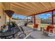 Covered patio featuring comfortable seating, a view of the backyard, and mountain views at 5731 Fonchester Ct, Las Vegas, NV 89110