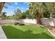 Backyard features artificial turf, a fire pit and a seating area at 5769 Larkdale St, Las Vegas, NV 89120