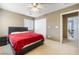 Bedroom with a red comforter and an en suite bathroom at 5769 Larkdale St, Las Vegas, NV 89120