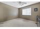 Simple bedroom with carpet, ceiling fan, and neutral decor; ideal for customization at 5769 Larkdale St, Las Vegas, NV 89120