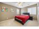 Comfortable bedroom with plush carpeting and stylish neutral wall paint at 5769 Larkdale St, Las Vegas, NV 89120