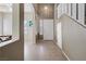 Bright foyer with tiled floors, staircase, and a view into the dining area at 5769 Larkdale St, Las Vegas, NV 89120