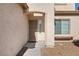 Welcoming front entrance with a security screen door, side window and a covered porch at 5769 Larkdale St, Las Vegas, NV 89120