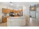 Spacious kitchen featuring a breakfast bar, stainless steel appliances, and tiled floors at 5769 Larkdale St, Las Vegas, NV 89120