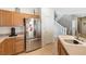 Kitchen with stainless steel refrigerator and tiled floors at 5769 Larkdale St, Las Vegas, NV 89120
