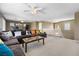 Second floor living area features a comfortable sofa and a balcony at 5769 Larkdale St, Las Vegas, NV 89120
