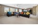 Spacious living room offers a large sectional sofa and plenty of natural light at 5769 Larkdale St, Las Vegas, NV 89120