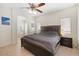 Comfortable main bedroom with neutral walls and ensuite bathroom featuring a tub at 5769 Larkdale St, Las Vegas, NV 89120