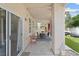 Covered patio features multiple seating areas and backyard views at 5769 Larkdale St, Las Vegas, NV 89120