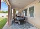 Covered patio with string lights and an outdoor table set at 5769 Larkdale St, Las Vegas, NV 89120