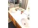 Bathroom featuring double sinks, wood cabinets, and a large mirror at 6030 Halehaven Dr, Las Vegas, NV 89110