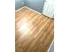 Bedroom with light wood flooring, white trim, and gray walls at 6030 Halehaven Dr, Las Vegas, NV 89110