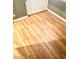 Bedroom with warm hardwood flooring, gray walls, and white trim at 6030 Halehaven Dr, Las Vegas, NV 89110
