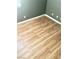 This empty bedroom is complete with light-colored hardwood flooring and gray walls at 6030 Halehaven Dr, Las Vegas, NV 89110