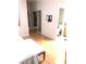 Bedroom features light wood floors, a walk-in closet, and access to an adjacent bathroom at 6030 Halehaven Dr, Las Vegas, NV 89110