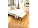 Bedroom featuring hardwood floors, curtains, comfortable bed, and teddy bear at 6030 Halehaven Dr, Las Vegas, NV 89110