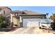 Charming single-story home with a two-car garage and well-maintained landscaping in a residential neighborhood at 6030 Halehaven Dr, Las Vegas, NV 89110