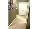 Hallway featuring tile flooring leading to a double door closet at 6030 Halehaven Dr, Las Vegas, NV 89110