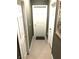Hallway with tiled floor and three doors leading to different rooms at 6030 Halehaven Dr, Las Vegas, NV 89110
