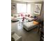 Bright living room featuring a contemporary white sectional sofa, glass coffee table, and neutral décor at 6030 Halehaven Dr, Las Vegas, NV 89110