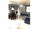 Bright living room and dining area with fireplace and comfortable seating arrangement at 6030 Halehaven Dr, Las Vegas, NV 89110