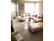 Well-lit living room features a sectional sofa, a glass coffee table, and contemporary decor at 6030 Halehaven Dr, Las Vegas, NV 89110