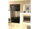 Cozy living room features built in media center and sleek fireplace at 6030 Halehaven Dr, Las Vegas, NV 89110