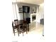 Living room and dining area featuring a built-in fireplace and modern decor at 6030 Halehaven Dr, Las Vegas, NV 89110