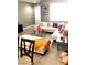 Comfortable living room with a white sectional sofa, glass coffee table, and stylish décor at 6030 Halehaven Dr, Las Vegas, NV 89110
