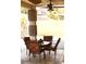 Covered patio area featuring an outdoor dining set and stylish columns at 6030 Halehaven Dr, Las Vegas, NV 89110