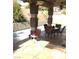 Inviting covered patio with tiled flooring and modern furniture set for outdoor enjoyment at 6030 Halehaven Dr, Las Vegas, NV 89110