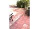 Outdoor patio with brick pavers and inviting seating area under a shady tree at 6030 Halehaven Dr, Las Vegas, NV 89110