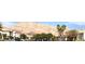 Scenic street view showcasing a neighborhood with mountain views and palm tree-lined streets at 6030 Halehaven Dr, Las Vegas, NV 89110