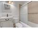 Traditional bathroom featuring a vanity, sink, toilet, and tiled shower with sliding glass doors at 6205 Parsifal Pl, Las Vegas, NV 89107
