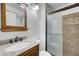 Bathroom features granite vanity and tiled shower at 6205 Parsifal Pl, Las Vegas, NV 89107