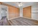 Spacious bedroom featuring wood floors, fan and lots of closet space at 6205 Parsifal Pl, Las Vegas, NV 89107
