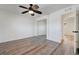 Large bedroom with fresh paint, closet and wood-look flooring at 6205 Parsifal Pl, Las Vegas, NV 89107