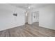 Well-lit bedroom boasts wood-look floors, fresh paint and closet at 6205 Parsifal Pl, Las Vegas, NV 89107