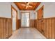 Hallway with wood walls and ceiling leading to the rest of the house at 6205 Parsifal Pl, Las Vegas, NV 89107